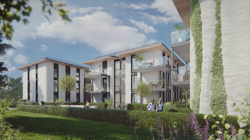 Eine moderne Wohnanlage mit mehreren Gebäuden, umgeben von gepflegten Grünflächen und Bäumen, unter einem klaren blauen Himmel.