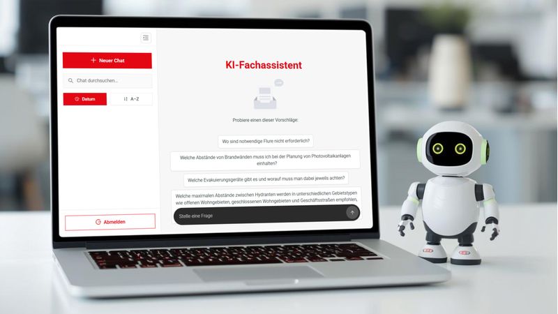 Ein Laptop mit einem KI-Fachassistenten auf dem Bildschirm steht auf einem Tisch, daneben ein kleiner Roboter.